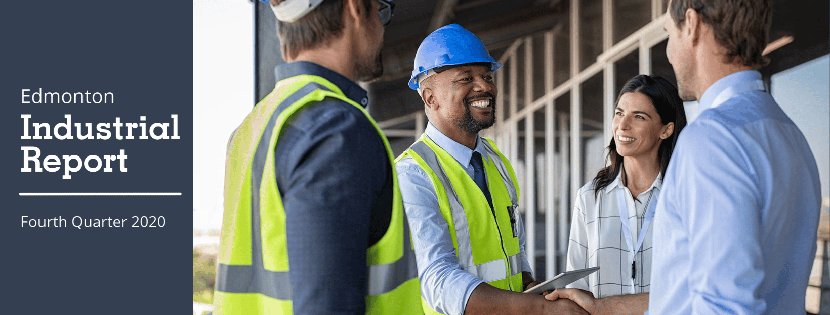 professionals wearing safety vests shake hands with other professionals